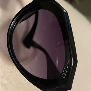 Gucci Black Frame Sunglasses with Dark Purple Lenses